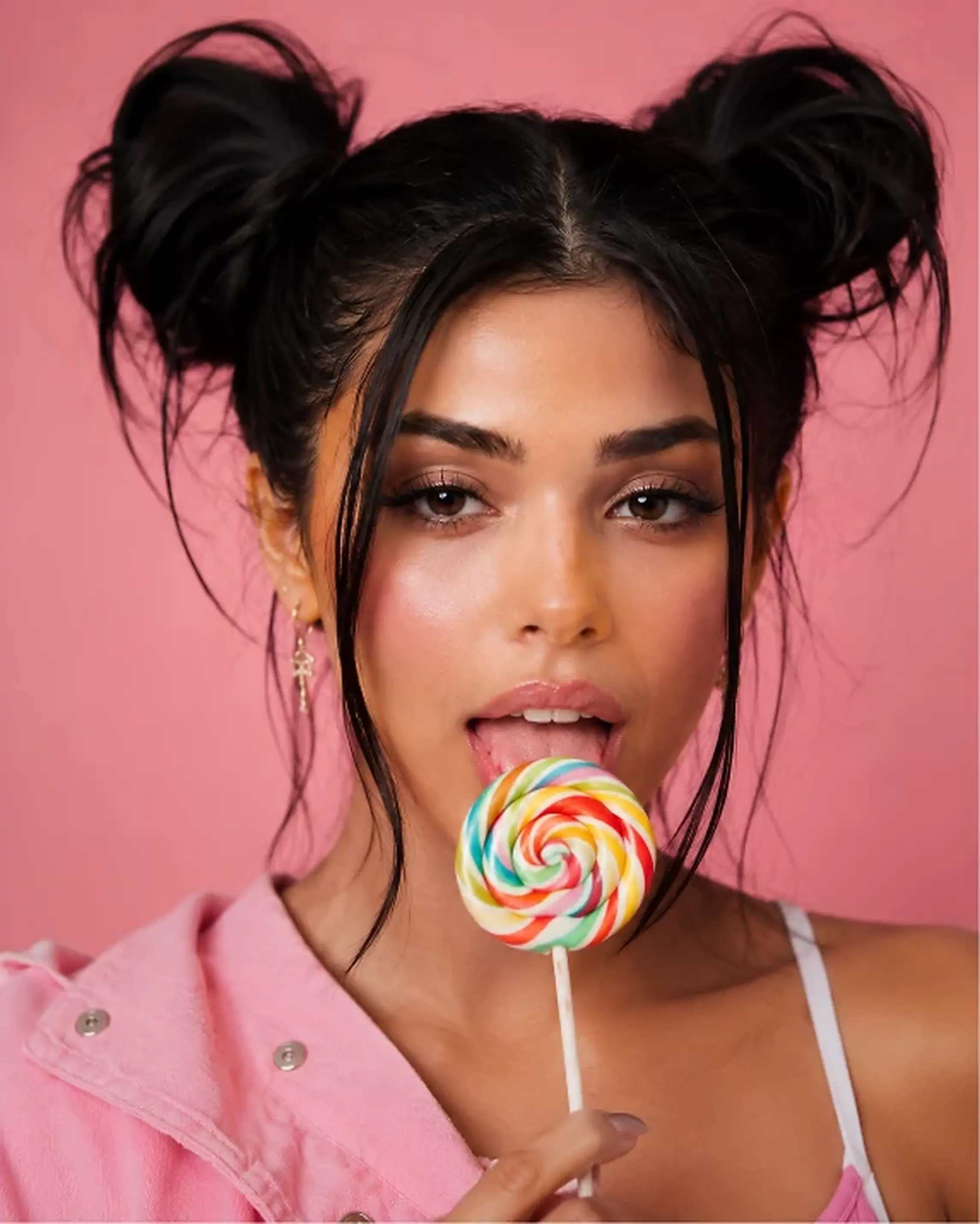 Colourful studio campaign portrait against a pink background